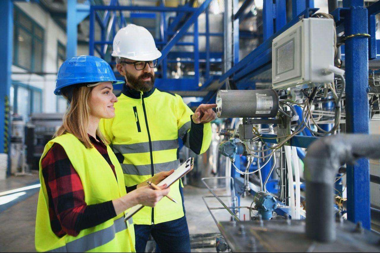 engineering-manager-and-mechanic-worker-doing-routine-check-up-in-industrial-factory-e1674669183542.jpg